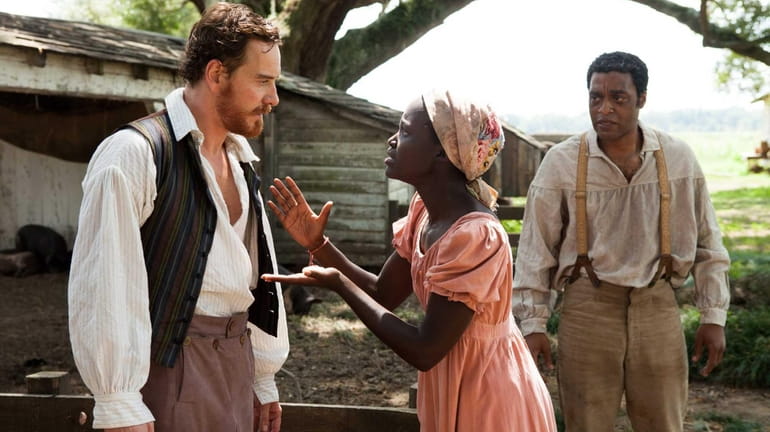 This image released by Fox Searchlight shows Michael Fassbender, left,...