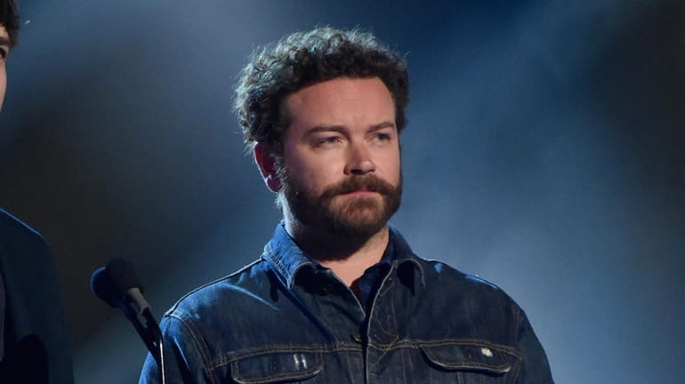 Danny Masterson presents an award onstage during the CMT Music...