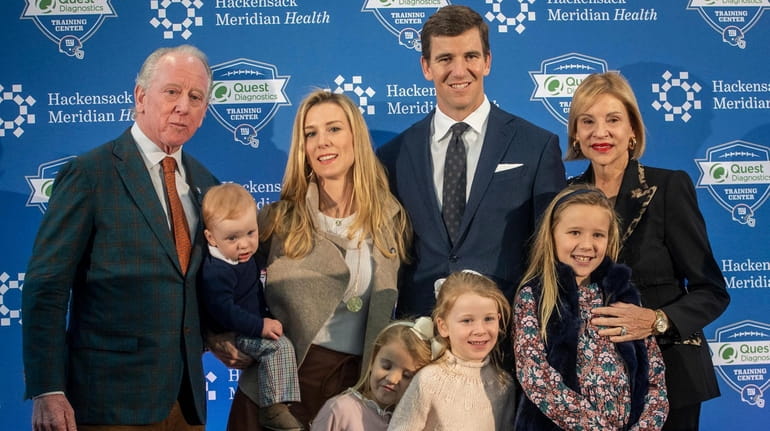 Eli Manning with his family, including former NFL quarterback Archie...