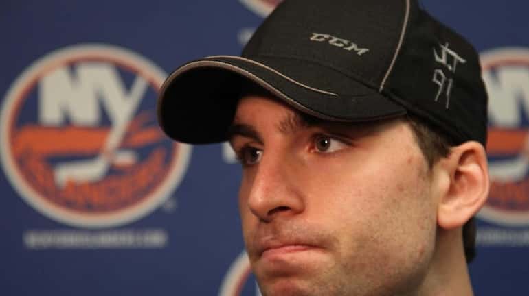John Tavares speaks to reporters about the season as he...