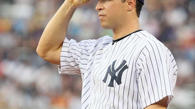 Mark Teixeira #25 of the New York Yankees looks on...