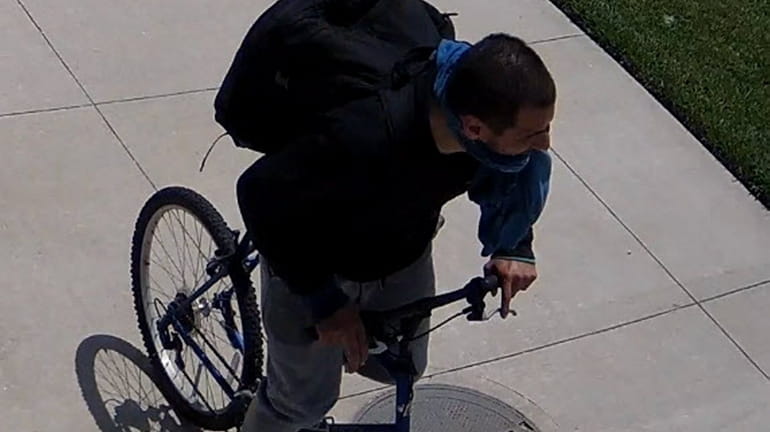The suspect seen here, who was also riding a bicycle, was...