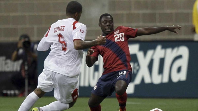 Freddy Adu of the United States attempts to control the...