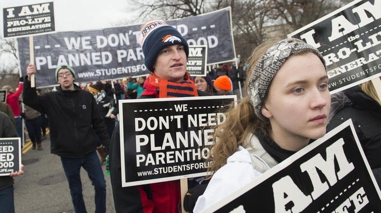 Pro-life demonstrators march towards the U.S. Supreme Court during the...