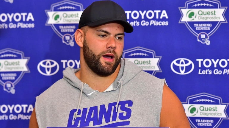 New York Giants offensive guard Justin Pugh speaks with the...