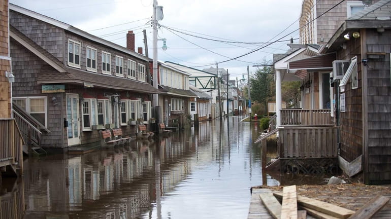 Streets of Ocean Beach on Fire Island were flooded by...