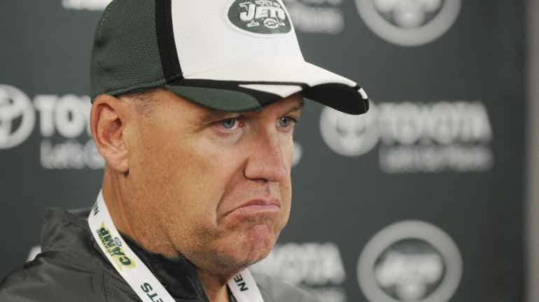 Jets head coach Rex Ryan talks with reporters after the...
