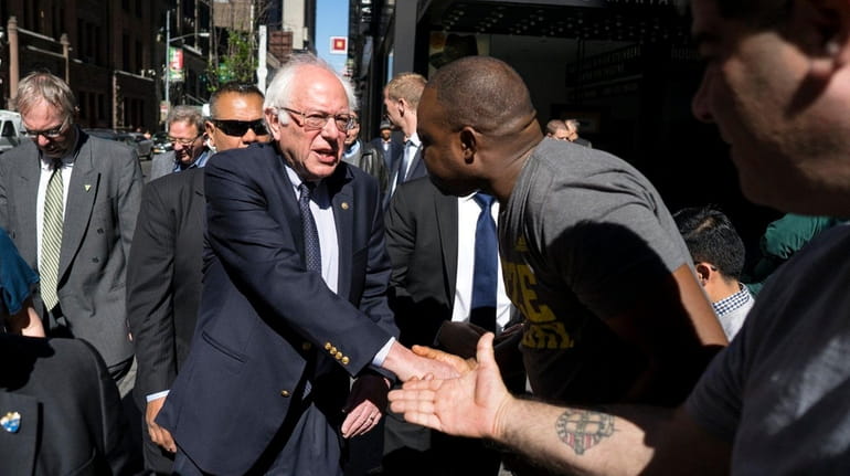 Democratic presidential candidate Bernie Sanders, greeting people near Times Square...
