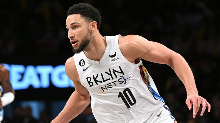 Nets guard Ben Simmons controls the ball against the Grizzlies...