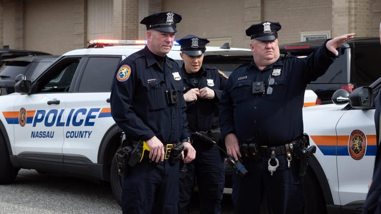Nassau County police officers at a news conference in Mineola where...