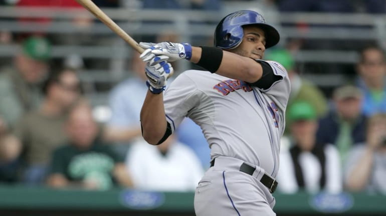 New York Mets' Fernando Martinez swings at a pitch by...
