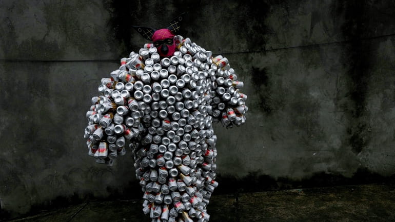 A reveler wearing a costume made from beer and soda...