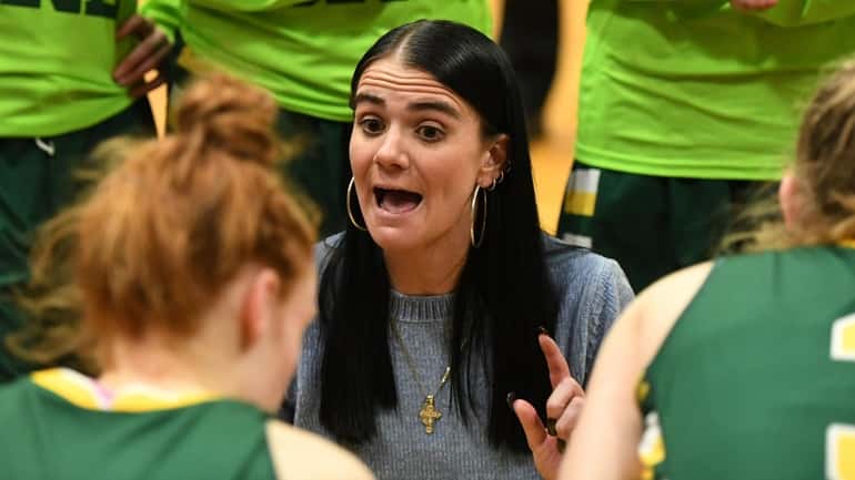 Ward Melville head coach Samantha Prahalis directs her players against...