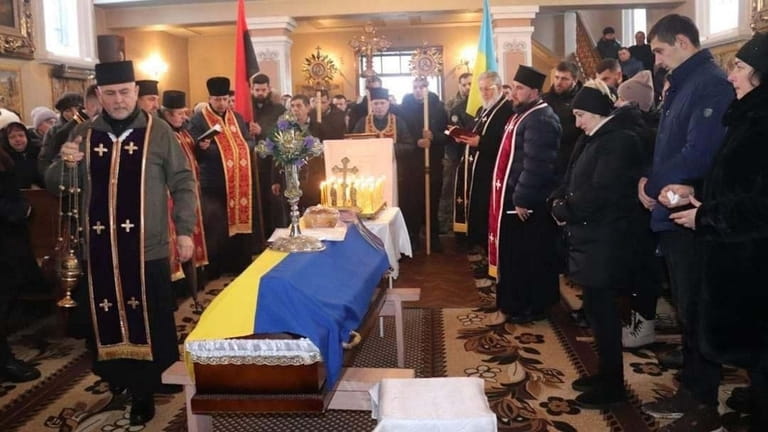 A Ukrainian soldiers’ funeral, as taken and attended by the...