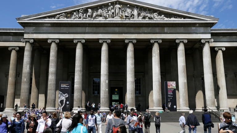 Visitors walk outside the British Museum in Bloomsbury, London, Friday,...