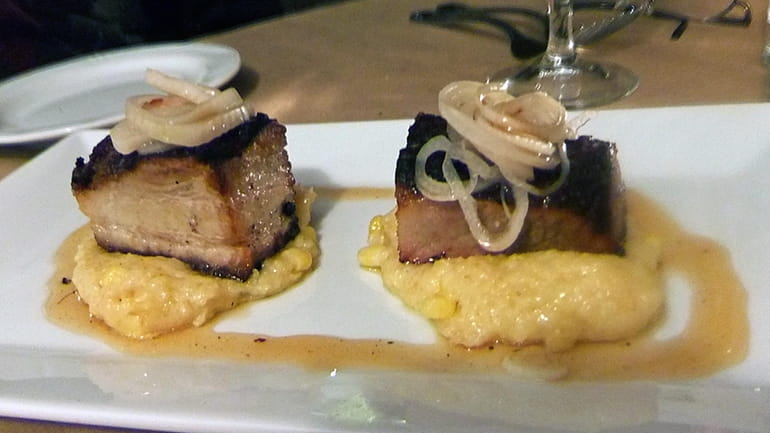 Braised pork belly over corn pudding at Bistro 25