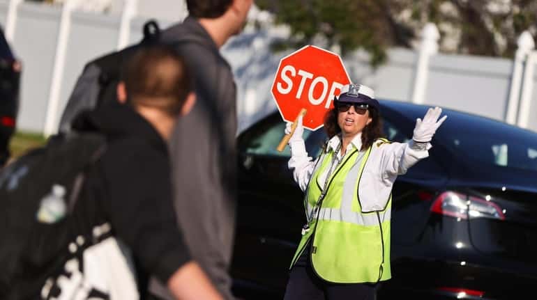 A Suffolk County crossing guard works her post near Lindenhurst...
