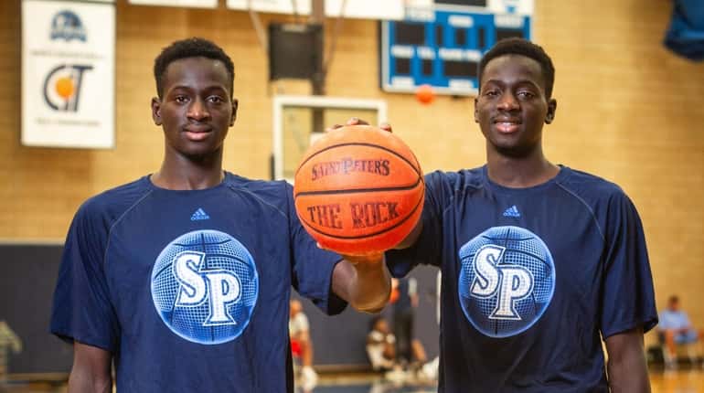 Hassan Drame, left, and his brother Fousseyni, at the gym...