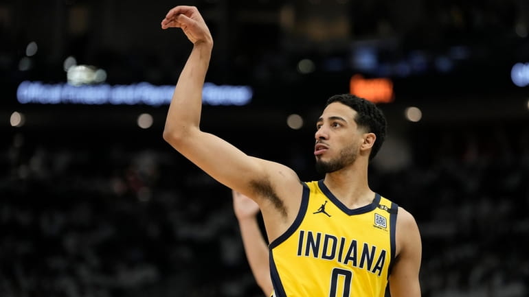 Indiana Pacers' Tyrese Haliburton reacts to his three pointer during...