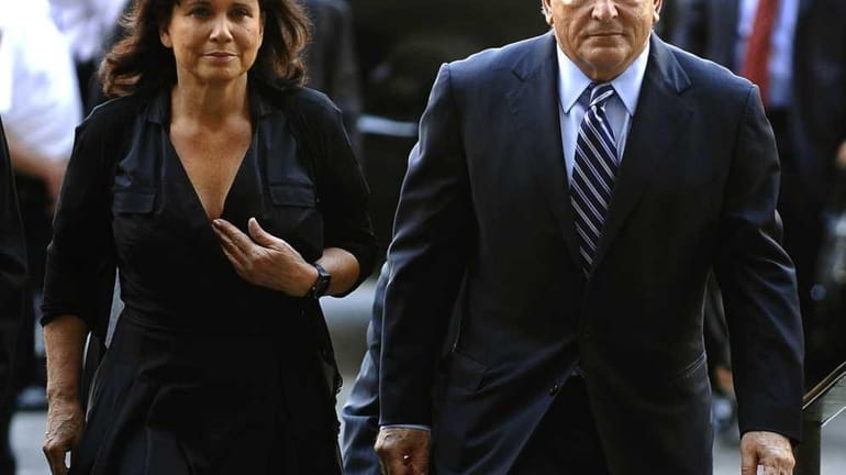 Former IMF head Dominique Strauss-Kahn and his wife Anne Sinclair...