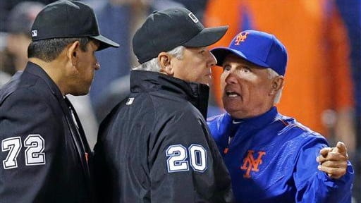 New York Mets manager Terry Collins argues with home plate...