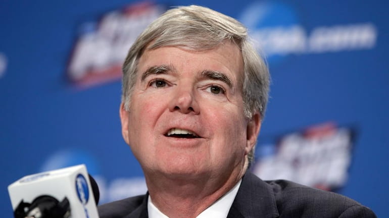 NCAA President Mark Emmert answers questions during a news conference...