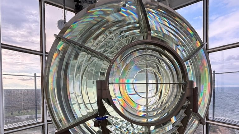 A closeup of the antique Fresnel lens recently reinstalled in...