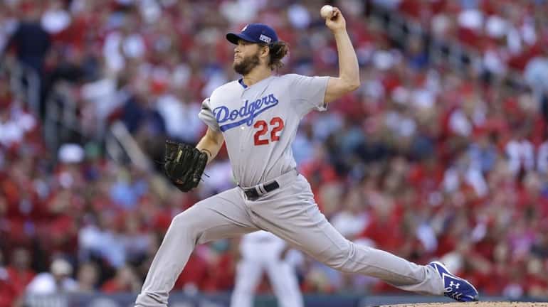 Los Angeles Dodgers starting pitcher Clayton Kershaw throws a pitch...