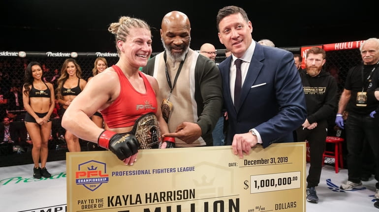 Kayla Harrison celebrates winning the PFL women's lighweight championship on...