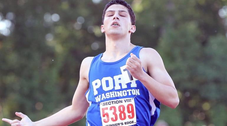 Port Washington's Aaron Siff-Scherr takes first in the boys Division...