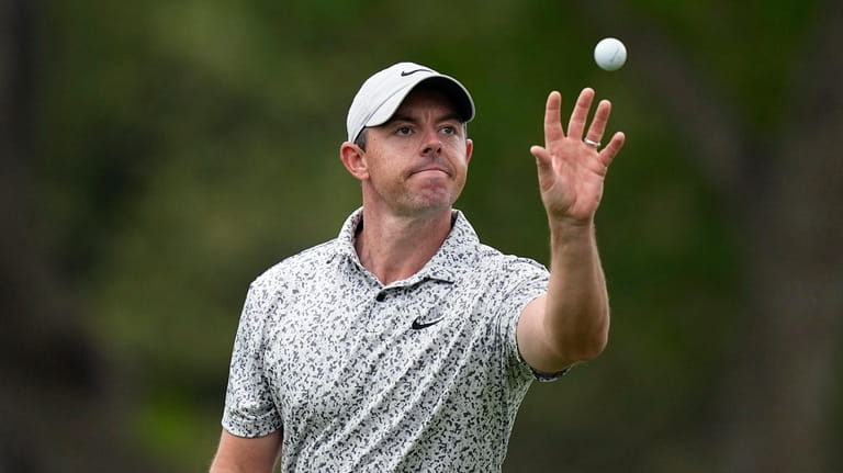 Rory McIlroy, of Northern Ireland, catches his ball on the...