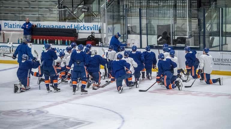 The Islanders gather during practice on Monday, April 22, 2019 at...