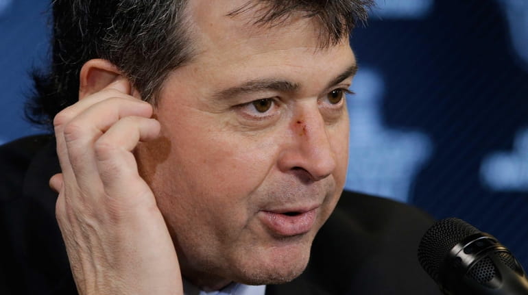 New York Islanders coach Jack Capuano, who was hit with...