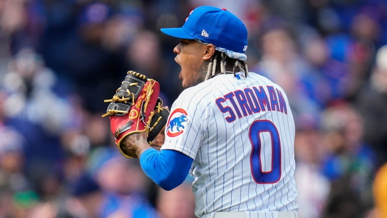 Chicago Cubs starting pitcher Marcus Stroman leaves the field after...