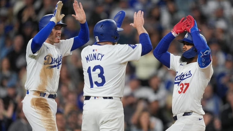 Los Angeles Dodgers' Teoscar Hernandez (37) celebrates his three-run home...