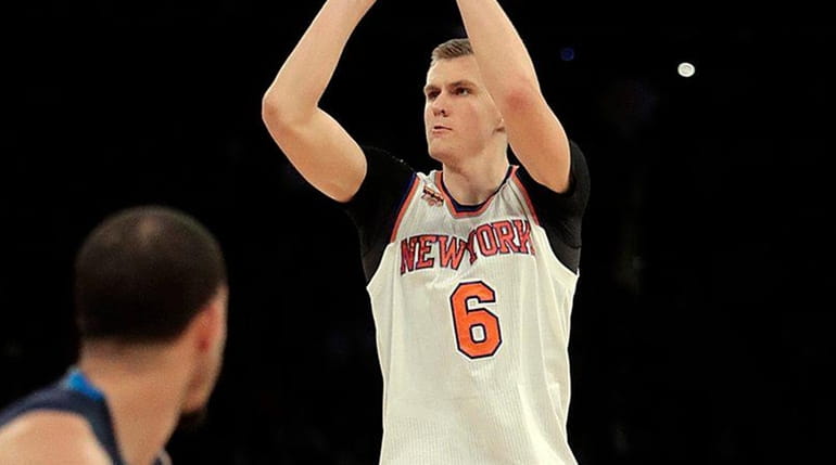 New York Knicks forward Kristaps Porzingis shoots for three from...