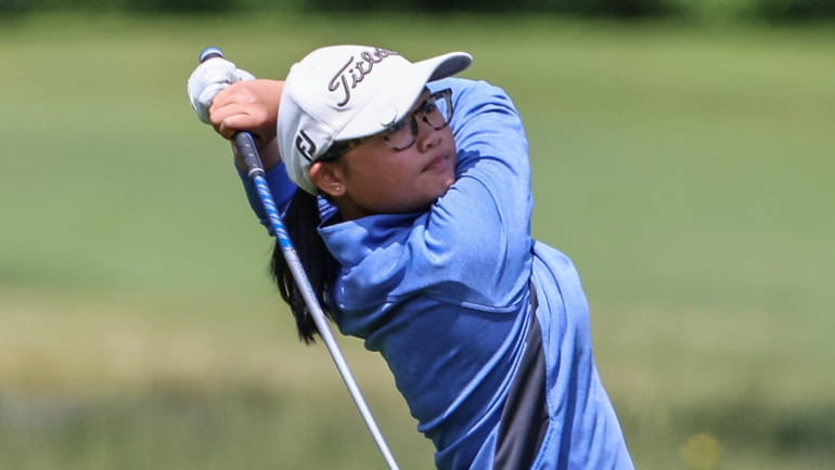 Caylin Wong of Great Neck District tees off during the...