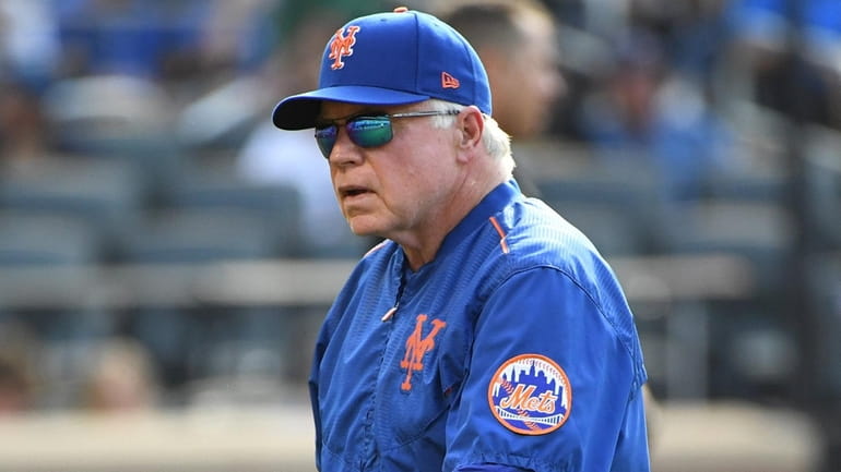 Mets manager Buck Showalter walks to the dugout after a...