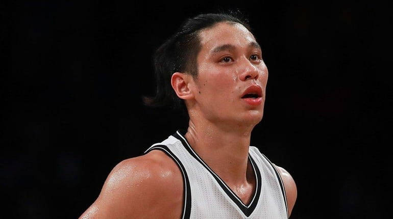 Jeremy Lin of the Brooklyn Nets reacts after hitting a...