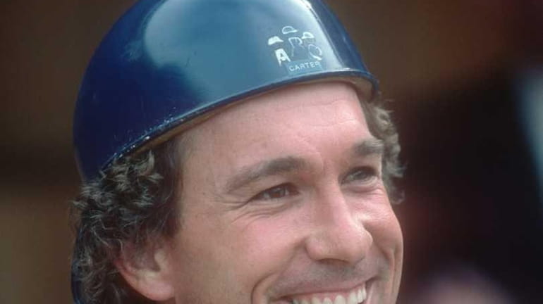 Catcher Gary Carter of the New York Mets looks on...