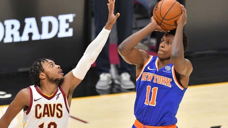 Frank Ntilikina #11 of the New York Knicks shoots over...