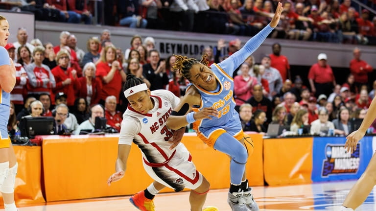 Tennessee's Jasmine Powell is fouled by North Carolina State's Zoe...
