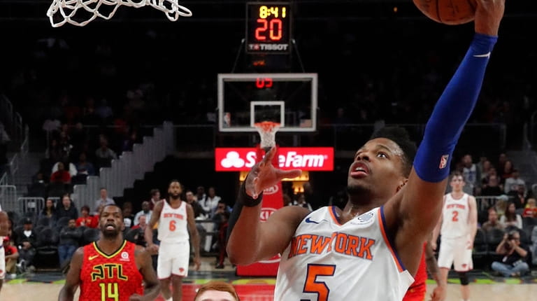 New York Knicks guard Dennis Smith Jr. (5) goes in...