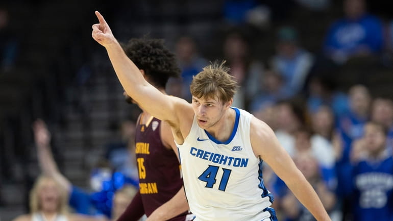 Creighton's Isaac Traudt (41) celebrates after making a three-pointer against...