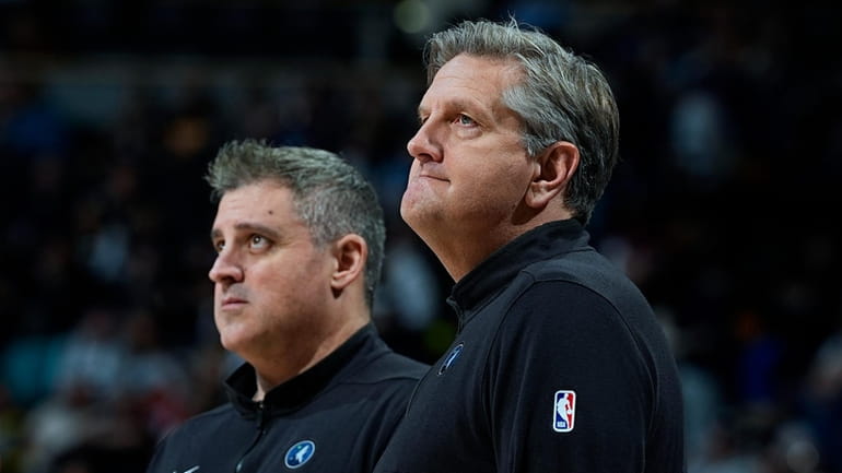 Minnesota Timberwolves head coach Chris Finch, right, and assistant coach...