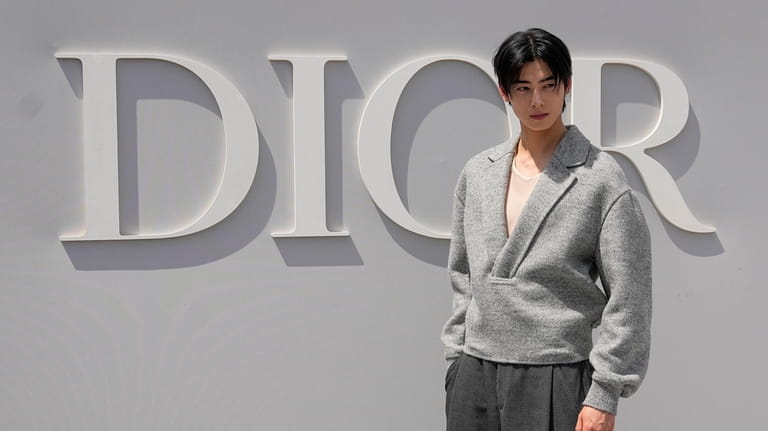 Cha Eun-woo poses for photographers upon arrival at the Dior...