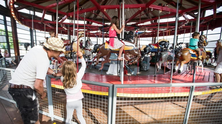 A restored 100-year-old carousel goes round and round with views...