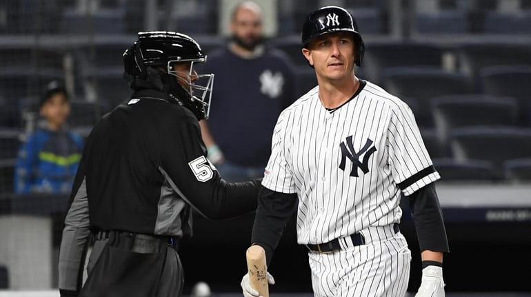 New York Yankees designated hitter Troy Tulowitzki reacts after he...
