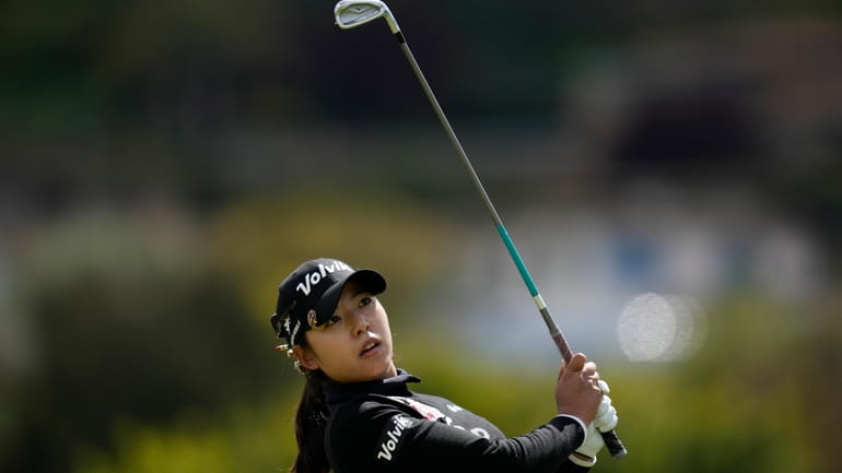 Mi Hyang Lee tees off at the 17th hole during...
