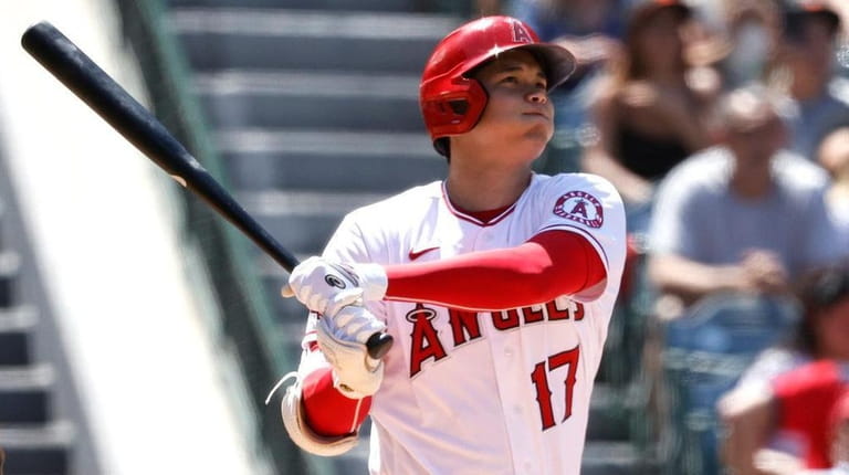 Shohei Ohtani of the Angels hits a solo home run...
